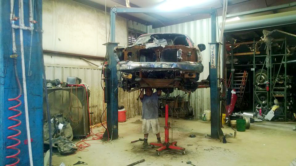 Vehicle on lift being dismantled
